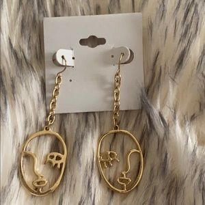Cutout face earrings